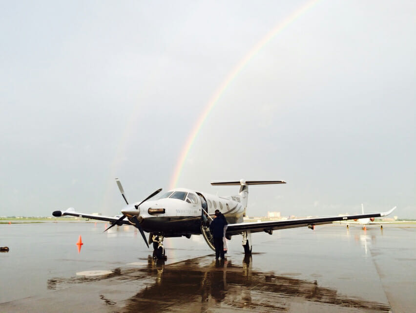 Pilatus PC-12 just after a quick shower and double rainbow. Photo provided by Boutique Air.